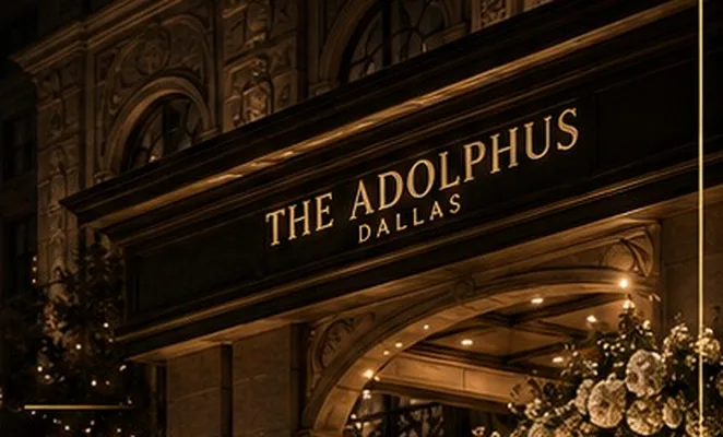 The Adolphus hotel entrance in Dallas decorated with flowers at night